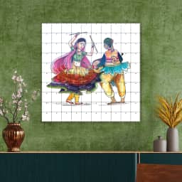 Beautiful couple playing dandiya