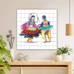 Beautiful couple playing dandiya